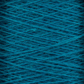 Close-up view of a large cone of JaggerSpun Zephyr Wool-Silk 2/18 Yarn by Jagger Brothers, Inc., showcasing its tightly wound dark teal threads in a criss-cross pattern. The texture appears slightly fuzzy, hinting at the softness of the material. This luxurious yarn boasts vibrant, rich colors that enhance its premium silk-like appeal.