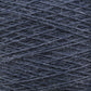 Close-up image of Jagger Brothers, Inc.'s luxurious JaggerSpun Zephyr Wool-Silk 2/18 Yarn in dark blue, with a slightly fuzzy texture, wound tightly in a pattern of overlapping diagonal lines. The yarn fibers and individual strands are visible, offering a detailed view of the material's texture and premium quality color.