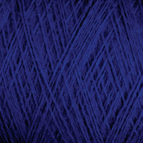 A close-up view of the dark blue, luxurious JaggerSpun Zephyr Wool-Silk 2/18 Yarn by Jagger Brothers, Inc., intricately wound into a large cone, displays the texture and strands in a web-like pattern. The fibers' rich color and tightly woven nature are clearly visible.