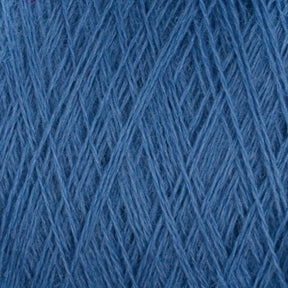 Close-up image of JaggerSpun Zephyr Wool-Silk 2/18 Yarn | Mini-cone by Jagger Brothers, Inc. The texture shows fine threads tightly wound together, forming a soft, smooth, and uniform surface suitable for knitting or crocheting. The shade of blue appears consistent throughout the image with no visual imperfections or variations.