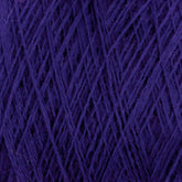 Close-up image of JaggerSpun Zephyr Wool-Silk 2/18 Yarn in deep purple. The luxurious strands from Jagger Brothers, Inc. are tightly wound and crisscrossing in various directions, creating an intricate and textured pattern. The yarn appears soft and dense, making it suitable for knitting or crocheting projects.