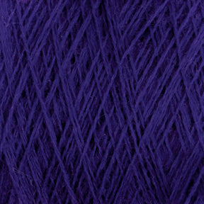 Close-up image of JaggerSpun Zephyr Wool-Silk 2/18 Yarn in deep purple. The luxurious strands from Jagger Brothers, Inc. are tightly wound and crisscrossing in various directions, creating an intricate and textured pattern. The yarn appears soft and dense, making it suitable for knitting or crocheting projects.