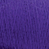 Close-up of a spool of JaggerSpun Zephyr Wool-Silk 2/18 Yarn from Jagger Brothers, Inc., in a rich, deep shade of purple. The image shows intricate, tightly wound strands creating a textured surface with some lighter shades appearing due to the lighting and texture.