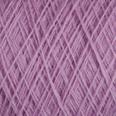 Close-up image of a ball of JaggerSpun Zephyr Wool-Silk 2/18 Yarn in pink, showcasing its interwoven strands that form a textured pattern. The yarn, made by Jagger Brothers, Inc., appears soft and fluffy—ideal for knitting, crocheting, or other crafts. Crafted from luxurious Australian merino wool blended with silk, the background is completely filled with the yarn to emphasize its texture and color.