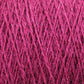 Close-up of bright pink JaggerSpun Zephyr Wool-Silk 2/18 Yarn by Jagger Brothers, Inc., showcasing the detailed texture and intertwined fibers. Made from luxurious Australian merino wool and silk blend, the image highlights the intricate pattern and individual strands of the yarn, giving a sense of its thickness and softness.