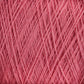 Close-up image of JaggerSpun Zephyr Wool-Silk 2/18 Yarn | Large Cone by Jagger Brothers, Inc., showcasing the tightly wound pink yarn that highlights the texture and fibers. The strands are intertwined and neatly arranged, emphasizing the soft and fluffy appearance of this luxurious Australian merino wool blend.