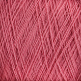 Close-up image of JaggerSpun Zephyr Wool-Silk 2/18 Yarn | Large Cone by Jagger Brothers, Inc., showcasing the tightly wound pink yarn that highlights the texture and fibers. The strands are intertwined and neatly arranged, emphasizing the soft and fluffy appearance of this luxurious Australian merino wool blend.