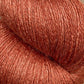 Close-up image of a skein of JaggerSpun Zephyr Wool-Silk 2/18 Yarn from Jagger Brothers, Inc. in a rich, reddish-brown color with a slightly shiny texture. The strands are tightly wound, highlighting the luxurious yarn's smooth and soft appearance.