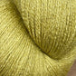 A close-up image of a skein of JaggerSpun Zephyr Wool-Silk 2/18 Yarn by Jagger Brothers, Inc. The blend of Australian merino wool and premium silk gives it a soft, textured feel with a slightly shiny appearance. The light green hue is vibrant and consistent throughout the skein.