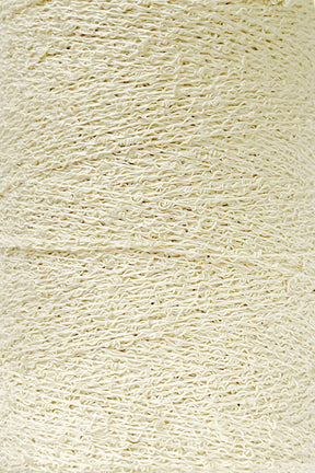 A close-up image of a large spool of cream-colored yarn. The yarn texture appears soft and slightly twisted, with visible fibers intertwined uniformly throughout the spool. Featuring what appears to be Cotton Bouclé Yarn in a Tube by Maurice Brassard, the image captures the intricate details and smoothness of the yarn's surface.