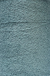 Close-up of a textured grey surface showing numerous intertwined, wave-like patterns. The material appears to be rough and fibrous, reminiscent of Maurice Brassard's intricate Cotton Bouclé Yarn, suggesting it could be a detailed portion of fabric or another textured synthetic material.