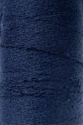 Close-up image of a spool of Maurice Brassard's Cotton Bouclé Yarn in dark navy blue. The texture of the yarn is clearly visible, showcasing a tightly wound, slightly uneven surface. This creation appears thick and sturdy, perfect for intricate weaving projects.