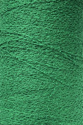 Close-up image of a spool of textured green yarn. The yarn, Cotton Bouclé Yarn Mini-Cone from Maurice Brassard, is made of 100% cotton and features a finely detailed wavy pattern. It is tightly wound around the spool, showcasing a consistent and intricate texture.