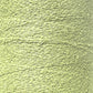 Close-up image of a spool of Maurice Brassard's Cotton Bouclé Yarn in light green. The yarn has a slightly uneven and loopy texture, reminiscent of classic bouclé, creating an intricate pattern across the surface of the tube.