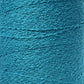 Close-up of a turquoise textured surface showing intricate patterns of thread or fibers, likely from Maurice Brassard's Cotton Bouclé Yarn. The surface exhibits a tightly woven, slightly rough texture with subtle variations in color due to the weave, reminiscent of premium Cotton Bouclé.