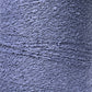 A close-up image of a grey textured surface, resembling tightly coiled and looped threads like those in Maurice Brassard's Cotton Bouclé Yarn. The intricate pattern creates a sense of depth and complexity across the entire view.