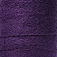 Close-up shot of a tightly wound spool of Maurice Brassard's Cotton Bouclé Yarn in purple. The slightly rough surface of this weaving yarn appears dense, with layers stacked consistently in a continuous pattern.