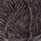 A close-up image of dark, woolen yarn, revealing the textured fibers and strands of Léttlopi (Lite Lopi) Icelandic Wool Yarn from Berroco, Inc. The yarn appears thick and slightly coarse, with a mix of dark gray and lighter gray fibers interwoven, giving it a rustic and natural appearance—perfect for creating durable garments or intricate colorwork knitting projects.