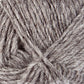 Close-up image of a ball of Léttlopi (Lite Lopi) Icelandic Wool Yarn by Berroco, Inc., showcasing an intricate texture where fibers are intertwined in a soft, fluffy manner. This gray yarn boasts a natural, woolly appearance—ideal for colorwork knitting or creating durable garments perfect for both knitting and crochet projects.