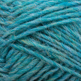 Close-up of a bundle of Léttlopi (Lite Lopi) Icelandic Wool Yarn in varying shades of teal and turquoise from Berroco, Inc. The fibers are slightly fuzzy, giving a soft and textured appearance. The yarn is wrapped loosely, showcasing its thickness and individual strands, perfect for colorwork knitting or durable garments.