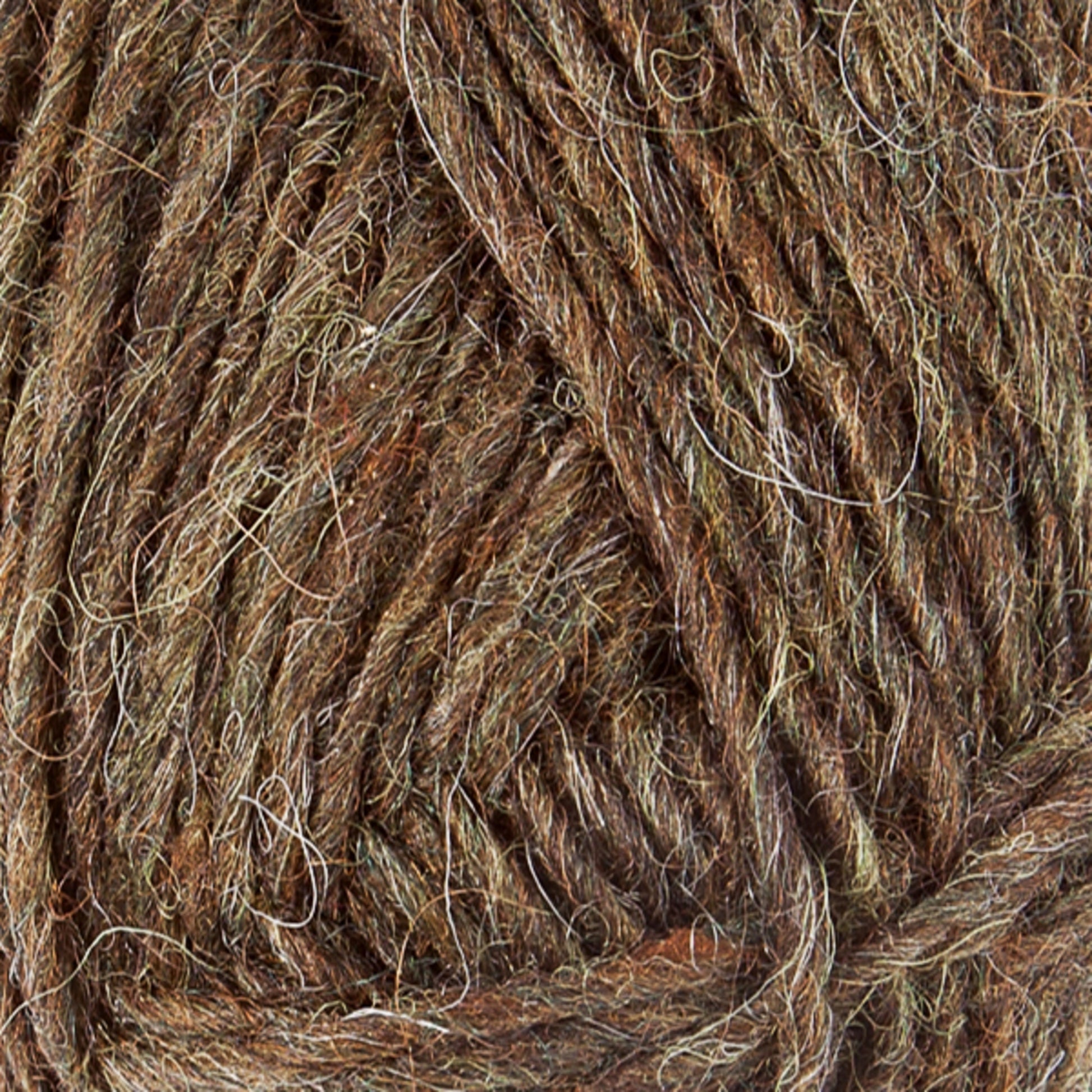 Close-up of brown and green Léttlopi Icelandic wool yarn by Berroco, Inc. The fibers are twisted together, creating a textured appearance with varying shades ideal for colorwork knitting. The image highlights the natural and earthy tones of the yarn, showcasing detail in the fibers and strands perfect for durable garments.