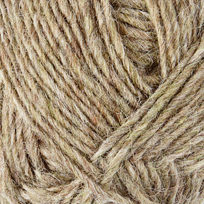 Close-up image of the beige and brown strands of Léttlopi (Lite Lopi) Icelandic Wool Yarn by Berroco, Inc., twisted together to showcase the texture and fiber details. The yarn appears thick and slightly fuzzy, featuring a natural, earthy tone—perfect for colorwork knitting or crafting durable garments.