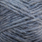 Close-up image of a ball of Berroco, Inc. Léttlopi (Lite Lopi) Icelandic Wool Yarn in blue. The fibers are thick and slightly tangled, with visible individual strands and a soft texture. The hue is a muted blue with subtle variations in shade, ideal for colorwork knitting or crafting durable garments.