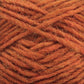 Close-up image of a ball of Léttlopi (Lite Lopi) Icelandic Wool Yarn in a rich, burnt orange color by Berroco, Inc. The strands are interwoven tightly, revealing a slightly fuzzy and soft surface, suitable for knitting or crocheting projects. Made from Icelandic wool, the texture suggests a cozy, warm material perfect for durable garments.