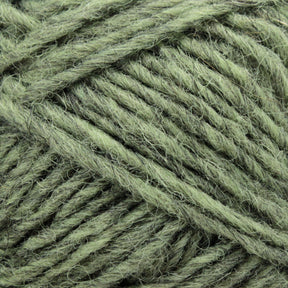 Close-up of several strands of the light green Léttlopi (Lite Lopi) Icelandic Wool Yarn by Berroco, Inc., intricately intertwined and showcasing the texture and fibers perfect for colorwork knitting.