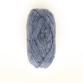 A single skein of Berroco, Inc.'s Léttlopi (Lite Lopi) Icelandic Wool Yarn in light blue is positioned against a plain white background. The neatly wound yarn has a slightly textured appearance, making it perfect for colorwork knitting and crafting durable garments.