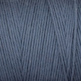 Close-up view of a ball of Cotton Carpet Warp 8/4 by Great Northern Weaving. The texture showcases tightly wound, even strands of blue-gray fiber, ideal for knitting or crocheting projects like cozy rag rugs or intricate coverlets.