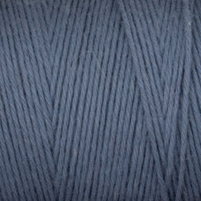 Close-up view of a ball of Cotton Carpet Warp 8/4 by Great Northern Weaving. The texture showcases tightly wound, even strands of blue-gray fiber, ideal for knitting or crocheting projects like cozy rag rugs or intricate coverlets.