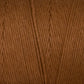 Close-up image of the warm, brown **Cotton Carpet Warp 8/4** by **Great Northern Weaving**. The texture shows detailed strands of twisted fibers, highlighting the soft and smooth appearance typical of this high-quality cotton warp yarn. The consistent color gives an impression of an evenly dyed material ideal for creating exquisite rag rugs.