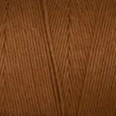 Close-up image of the warm, brown **Cotton Carpet Warp 8/4** by **Great Northern Weaving**. The texture shows detailed strands of twisted fibers, highlighting the soft and smooth appearance typical of this high-quality cotton warp yarn. The consistent color gives an impression of an evenly dyed material ideal for creating exquisite rag rugs.