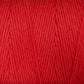 Close-up of Great Northern Weaving's Cotton Carpet Warp 8/4 in red, revealing the detailed texture and individual strands tightly wound together. The yarn appears to be soft and evenly colored throughout, ideal for knitting or crocheting projects like rag rugs or coverlets.