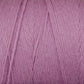 Close-up of a ball of Cotton Carpet Warp 8/4 from Great Northern Weaving in a soft pastel purple color. The cotton warp yarn fibers appear thick and smooth, with visible texture and strands neatly wound together. The color is consistent throughout, creating a gentle and cozy feel, reminiscent of handmade coverlets.