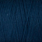 A close-up of Great Northern Weaving's Cotton Carpet Warp 8/4 in dark blue. The yarn strands are neatly wound, creating a textured pattern across the image. The color is deep and rich, with a slight sheen highlighting the individual fibers—perfect for crafting rag rugs or coverlets.