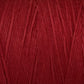 A close-up image of Great Northern Weaving's Cotton Carpet Warp 8/4. The yarn's texture is clearly visible, showcasing fine threads tightly spun together. The rich red color is uniform throughout, highlighting the softness and quality of this cotton warp yarn often used in coverlets.