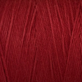 A close-up image of Great Northern Weaving's Cotton Carpet Warp 8/4. The yarn's texture is clearly visible, showcasing fine threads tightly spun together. The rich red color is uniform throughout, highlighting the softness and quality of this cotton warp yarn often used in coverlets.