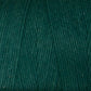 Close-up image of Great Northern Weaving's Cotton Carpet Warp 8/4 in green, highlighting the texture and tightly wound fibers. The yarn is made of cotton, ideal for knitting, crochet projects, or crafting beautiful rag rugs.