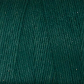 Close-up image of Great Northern Weaving's Cotton Carpet Warp 8/4 in green, highlighting the texture and tightly wound fibers. The yarn is made of cotton, ideal for knitting, crochet projects, or crafting beautiful rag rugs.