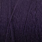 Close-up shot of Great Northern Weaving's Cotton Carpet Warp 8/4 in dark purple, showcasing its texture and tightly-wound strands. The fibers appear soft and smooth, suitable for knitting, crochet projects, or crafting coverlets.