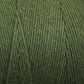 A close-up view of a thick spool of Great Northern Weaving's Cotton Carpet Warp 8/4 in green. The tightly wound fibers show a slightly fuzzy texture, perfect for crafting rag rugs or coverlets. The yarn appears to be of medium weight and has a natural, muted green color.