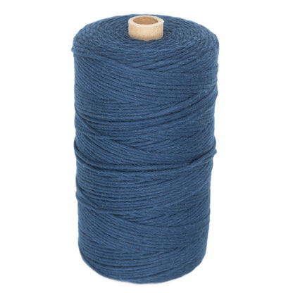 A medium blue spool of Maurice Brassard's Medium Cotton 16/8 Mop Yarn with a wooden core stands upright against a white background. The yarn, ideal for knitting or weaving, is neatly wound around the spool, and the end of the yarn is not visible.