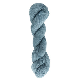 A skein of Jade Sapphire Cashmere 2-Ply, hand-dyed in a light blue hue by Jade Sapphire Exotic Fibres, beautifully displayed against a plain white background and ideal for creating delicate lacy accessories.