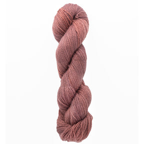 The Jade Sapphire Cashmere 2-Ply yarn from Jade Sapphire Exotic Fibres is tightly twisted, light brown, and ideal for crafting lacy scarves. It is showcased against a plain white background.