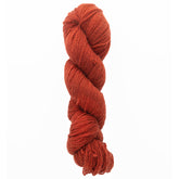 The Jade Sapphire Cashmere 2-Ply yarn by Jade Sapphire Exotic Fibres is a tightly twisted, hand-dyed skein that showcases rich red hues against a simple white background.