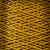 A close-up view of a neatly wound spool of 3/2 Pearl Cotton Yarn by Supreme Corp, in a golden-yellow shade. The yarn is tightly woven in an overlapping pattern, creating a textured, crisscross appearance. The fibers are slightly fuzzy, adding a soft and cozy look to the image.