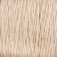 Close-up of a large cone of Supreme Corp's 3/2 Pearl Cotton Yarn, displaying its detailed texture and tightly wound strands. The versatile yarn appears to be made of a natural fiber, with slight variations in color and thickness visible throughout.