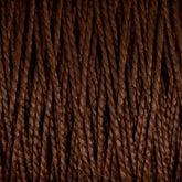 Close-up image of Supreme Corp's 3/2 Pearl Cotton Yarn on a large cone, with brown mercerized yarn strands lined up vertically, showcasing variations in texture and shading. The yarn appears thick and tightly wound, making it suitable for knitting or crocheting. This versatile yarn offers durability and a silky sheen, making it ideal for various crafting projects.